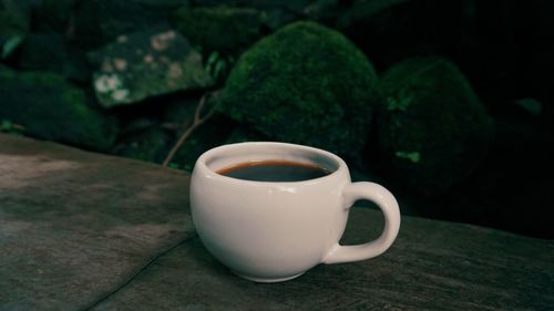 Close-up of coffee cup on table