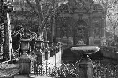 Statue of building against trees and plants