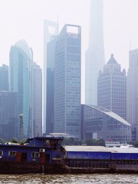 Modern buildings in city against sky