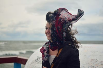 Woman standing against sky