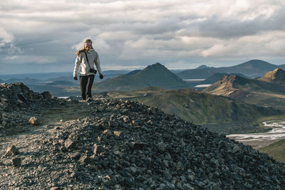 Photographer hiking in landmannalaugar