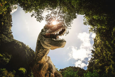 Low angle view of statue against sky