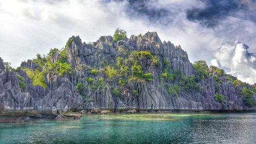 Scenic view of sea against cloudy sky
