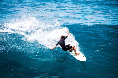 High angle view of man swimming in sea