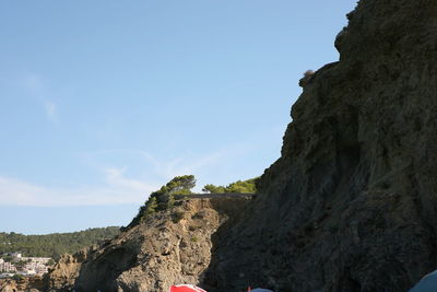 Low angle view of rock formations against sky