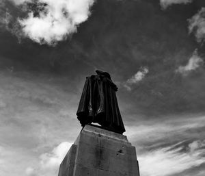 Low angle view of statue against sky