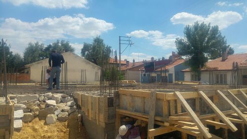 Houses and buildings against sky