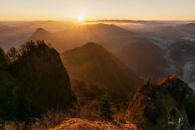 Scenic view of mountains against sky during sunset