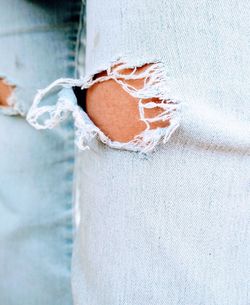 Close-up of human hand against white wall