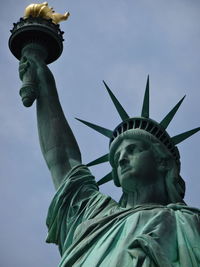 Statue of liberty against blue sky