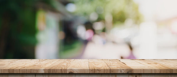 Close-up of paper on wooden table