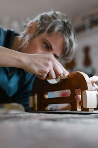 Portrait of a young woman preparing food