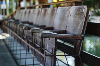 Close-up of empty chairs on table