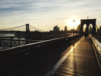 Brooklyn bridge against sky during sunset