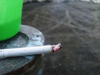 Close-up of cigarette against black background