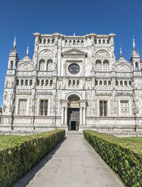 Facade of temple against clear blue sky