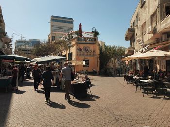 People walking on city street
