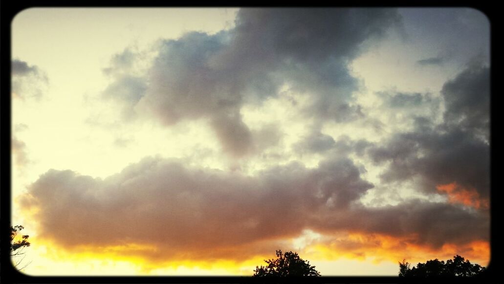 sky, sunset, cloud - sky, beauty in nature, transfer print, scenics, tranquility, tranquil scene, low angle view, cloudy, orange color, nature, silhouette, auto post production filter, dramatic sky, cloud, idyllic, tree, weather, overcast