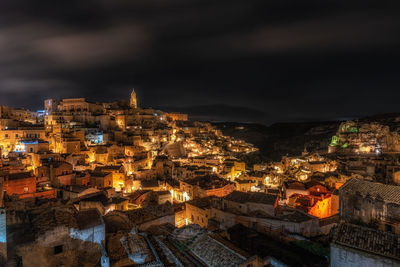 High angle view of illuminated buildings in city at night
