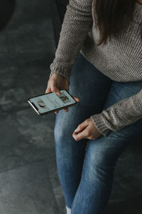 Womans hands using phone