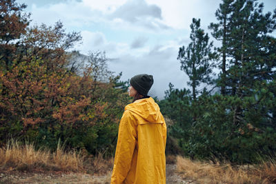 Rear view of man standing on field