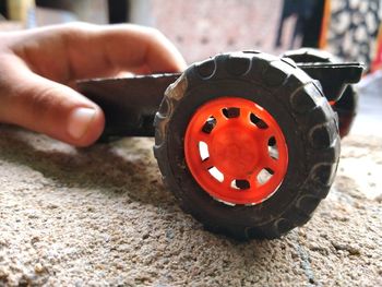 Close-up of hand holding toy car