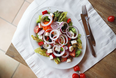 High angle view of fruits in plate on table