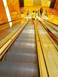 People on escalator at subway station