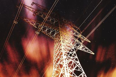 Low angle view of illuminated lighting equipment