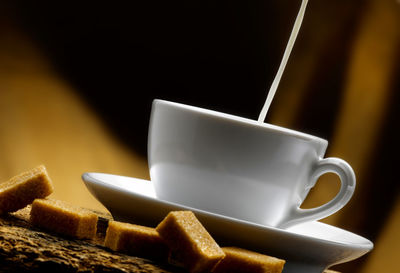 Close-up of coffee cup on table