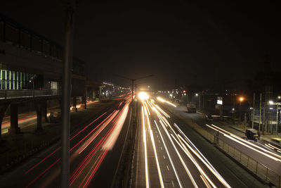 High angle view of light trails on road at night