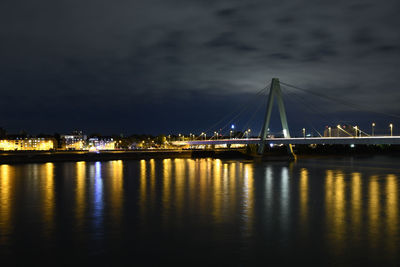 Severinsbrucke and the rhine at night in cologne, germany