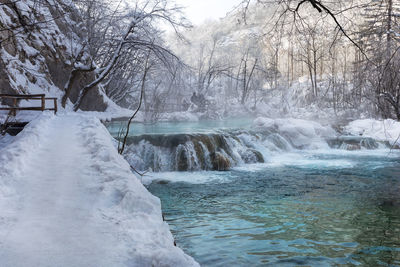Scenic view of frozen river during winter