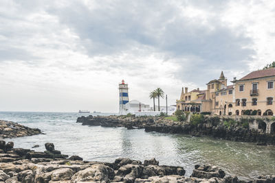 View of santa marta lighthouse on the estuary of the river tagus in cascais, portugal
