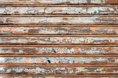 Old metallic store blinds with signs of usage