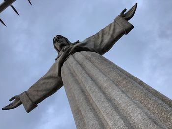 Low angle view of statue against sky
