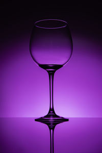 Close-up of wineglass against white background