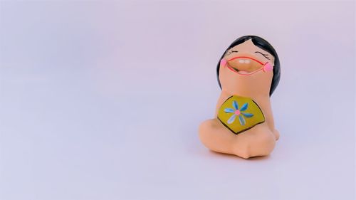 Close-up of toy against white background