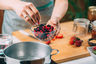 Midsection of woman preparing food