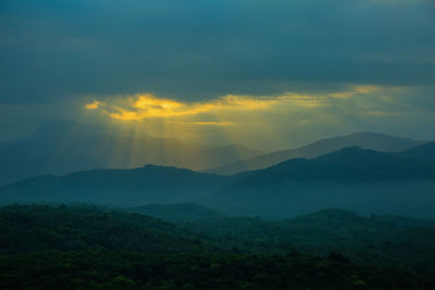 Scenic view of mountains against sky during sunset