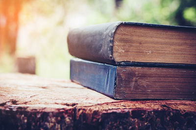 Ancient books on a wooden table , literacy and knowledge concept