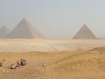 Panoramic view of people on desert against sky