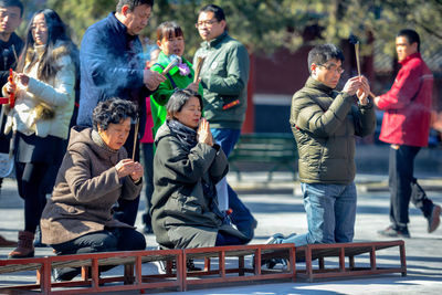 Group of people looking at market