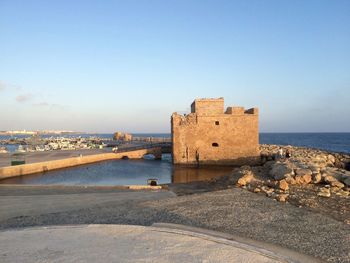 View of sea against clear blue sky