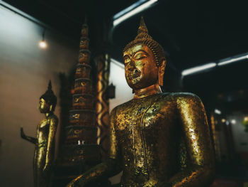 Statue against temple in building