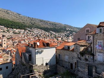 High angle view of buildings in city against clear sky