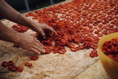 Cropped hand of person preparing food