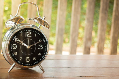 Close-up of clock on table