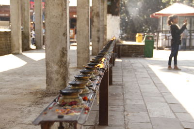 Lit diya on table in temple