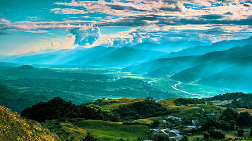 Aerial view of landscape and mountains against sky